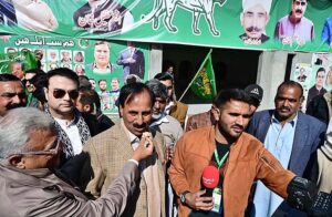 PML-N candidate Anjum Aqeel Khan with supporters celebrates after won the election for National Assembly constituency NA-46 Islamabad Capital Territory according to the unofficial result.