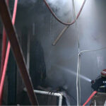 Firefighters struggling to extinguish the fire that erupted in shops at Mughal Sarai Market Raja Bazaar.