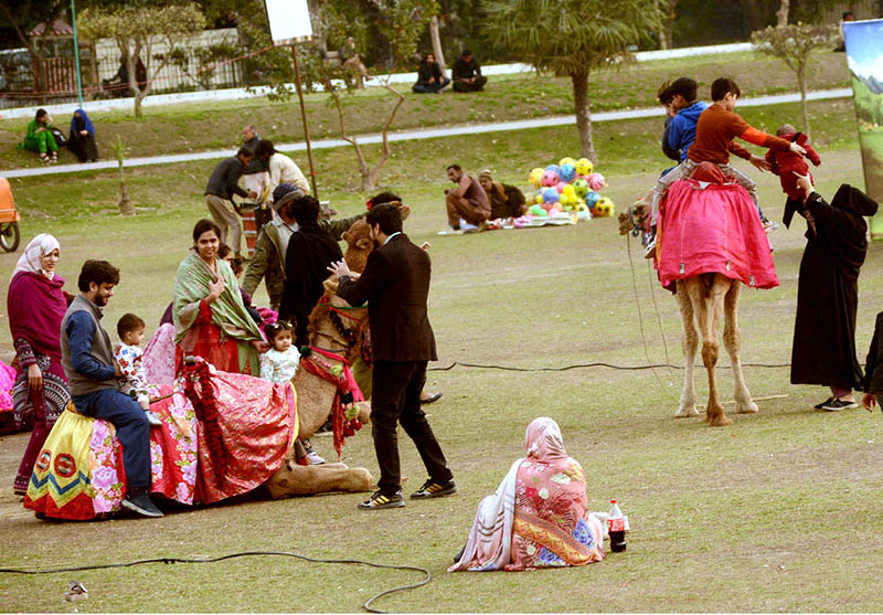 Families enjoying camel ride at Jilani Park