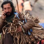 A street vendor looking for customers to sell traditional teeth cleaning stuff at Khanna Pul