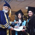 DG, FDE Tanveer Ahmed Principal Prof Rozina Faheem awarding Gold medal to a student in 3rd Convocation of FG Home Economics College F11/1