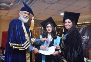 DG, FDE Tanveer Ahmed Principal Prof Rozina Faheem awarding Gold medal to a student in 3rd Convocation of FG Home Economics College F11/1