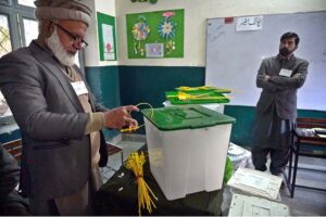 Polling officials showing the empty ballot boxes before start the polling in the polling station during General Election-2024