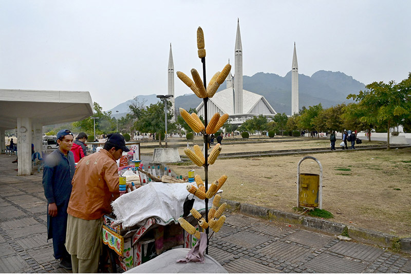 A vendor displayed corn to attract customers in the premises of Faisal Masjid