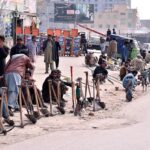 A Large number of Labourers waiting for Customers at Khanna Bridge.