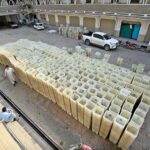 Workers of the Election Commission Office sorting ballot boxes to be sent to polling stations for the upcoming General Elections-2024 at office of the Election Commission, Kohat Road