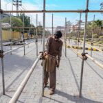 A labouer busy on making way for the spectators to the Pindi Cricket Stadium ahead of planned PSL matches scheduled there.