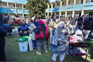 Polling staff receiving polling material for General Elections 2024 at G8 distribution Centre in the Federal Capital.