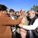 Supporters of independent candidate from PK-82, Peshawar-II, Malik Tariq Awan offering sweets to celebrate his victory in the General Election according to unofficial result.