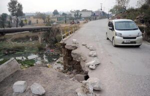 A view of damaged road leading to Bari Imam shrine in the Federal Capital.