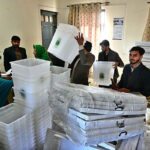 Polling staff receiving polling material for General Elections 2024 at G8 distribution Centre in the Federal Capital.