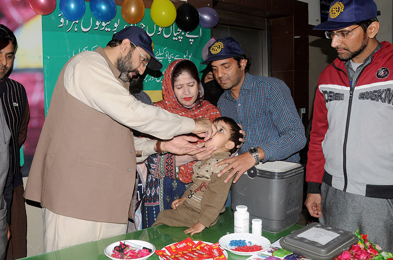 Deputy Commissioner Captain (retired) Rizwan Qadeer is administering Polio Drops to a child during the inauguration of a three-day Anti-Polio Campaign at Shahbaz Sharif Hospital