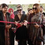 Chief Guest Mushaal Hussein Mullick, SAPM Human Rights and Women Empowerment cutting ribbon to inaugurate an Exhibition on Kashmir at National College of Arts