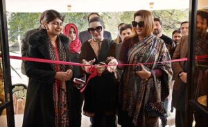 Chief Guest Mushaal Hussein Mullick, SAPM Human Rights and Women Empowerment cutting ribbon to inaugurate an Exhibition on Kashmir at National College of Arts