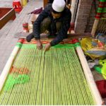 A man is busy in making traditional Charpai in his work place at the Kohati area