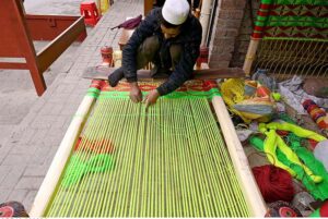 A man is busy in making traditional Charpai in his work place at the Kohati area