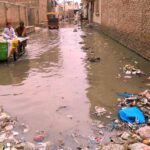 A view of accumulated water and blocked sewerage at Riaz Shah Kothi Road needs the attention of concerned authorities