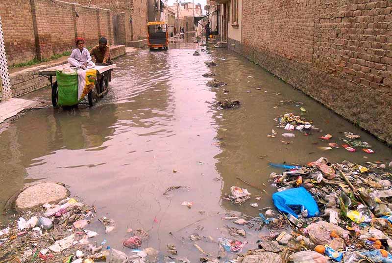 A view of accumulated water and blocked sewerage at Riaz Shah Kothi Road needs the attention of concerned authorities