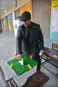 A person casts his vote in the polling station during General Election-2024