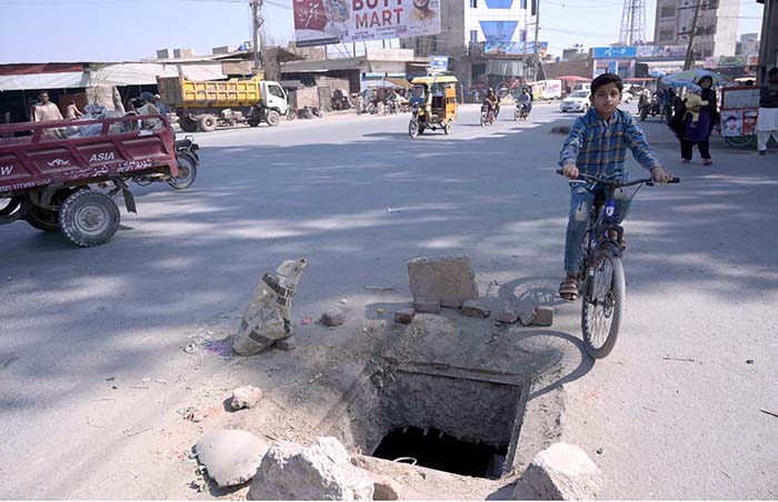 A view of on open main hole at Chungi No 9 needs attention of the concerned authorities.