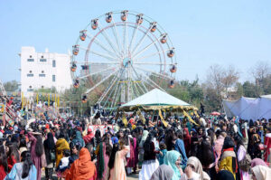 Students enjoy swings during 2nd Job Fair & Industrial Expo-2024 at Government College Women University.