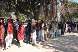 A large number of voters in queue to cast their vote outside a polling station during General Election-2024. 