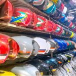 A shopkeeper displays motorcycle’s fuel tanks to attract the customers at his display center