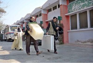 Polling staff receiving polling material at distribution Centre for General Elections 2024.