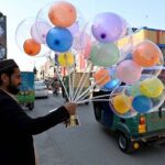 Vendor selling and displaying colorful balloons to attract the customers at Cantt Bazar.