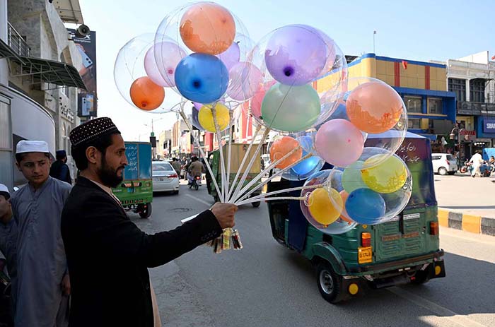 Vendor selling and displaying colorful balloons to attract the customers at Cantt Bazar.