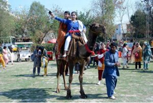 Students enjoy swings during 2nd Job Fair & Industrial Expo-2024 at Government College Women University.