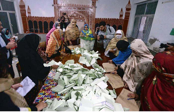 Polling officials counting votes during General Election 2024.