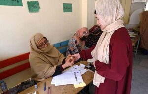 A security personnel standing alert outside a polling station during General Election-2024.