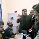 Federal Minister for interior Dr. Gohar Ejaz visiting a polling station on Adiala Road.