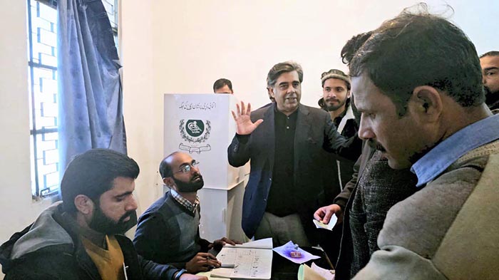 Federal Minister for interior Dr. Gohar Ejaz visiting a polling station on Adiala Road.