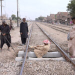 Railway workers are busy in repairing railway track near Railway Station during maintenance work.