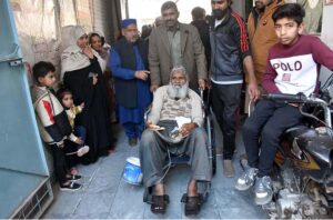 A senior citizen casting her vote in a polling station during General Elections 2024.