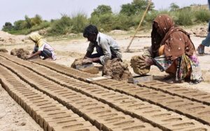 Labourers busy in preparing bricks at local bricks kiln. 