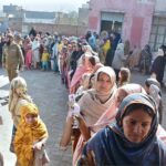 A large number of women in queue outside a polling station to cast their vote during General Election-2024