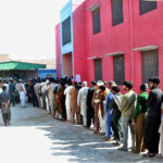 A large number of people in queue to cast their vote in a polling station during General Election-2024