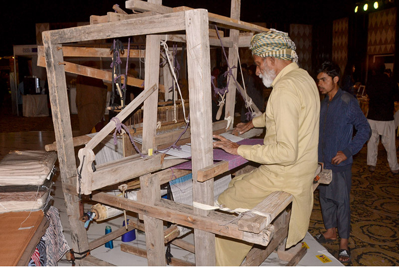 An artisan demonstrating his skills during the Bleu fair organized by the Women Chamber of Commerce