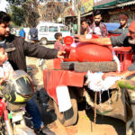 A vendor selling traditional drink (Kanji) at his roadside setup in Provincial Capital