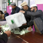 Polling officials open ballot boxes to count the votes at polling station Government Sardar Schoo Garhi Shahul during the General Election-2024