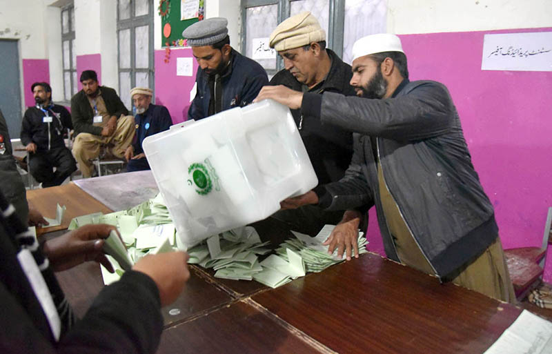 Polling officials open ballot boxes to count the votes at polling station Government Sardar Schoo Garhi Shahul during the General Election-2024
