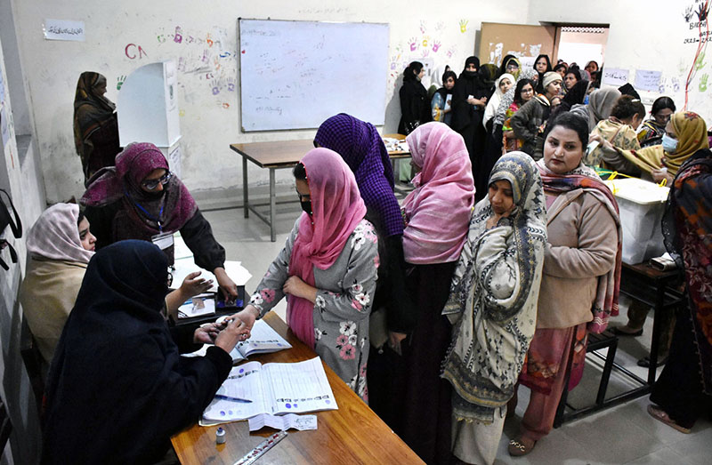 Polling officials open ballot boxes to count the votes at polling station Government Sardar Schoo Garhi Shahul during the General Election-2024