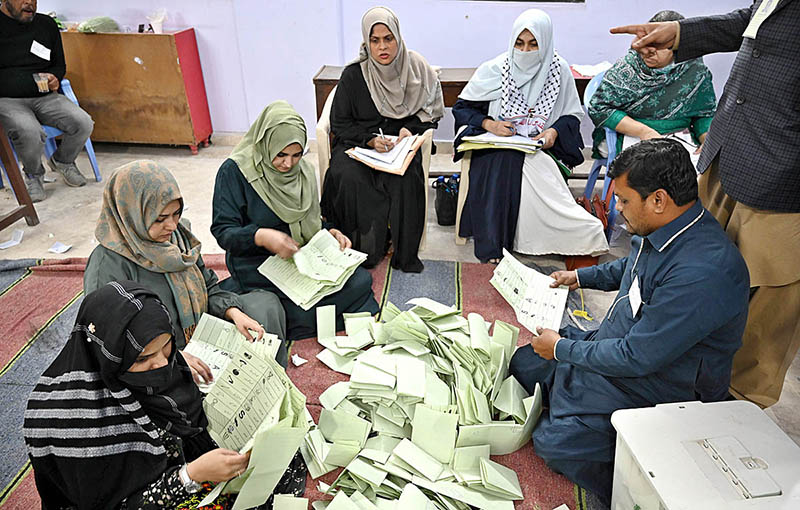 Polling staff opens ballot boxes in presence of poling agents for counting votes during General Elections 2024