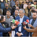 Caretaker Sindh Chief Minister Justice (R) Maqbool Baqar talks to media just after casting his vote at Government Boys Secondary School No.2, Block-6, PECHS
