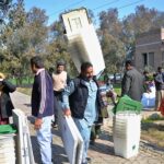 Polling staff receiving polling material at distribution Centre for General Elections 2024.
