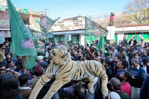 PML-N candidate Hanif Abbsi reacts to the supporters celebrating the success of securing the National Assembly seat NA-56 Rawalpindi according to unofficial result.