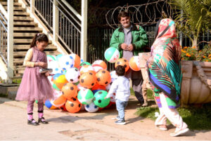 A vendor displayed colorful balloons to attract the customers at the roadside